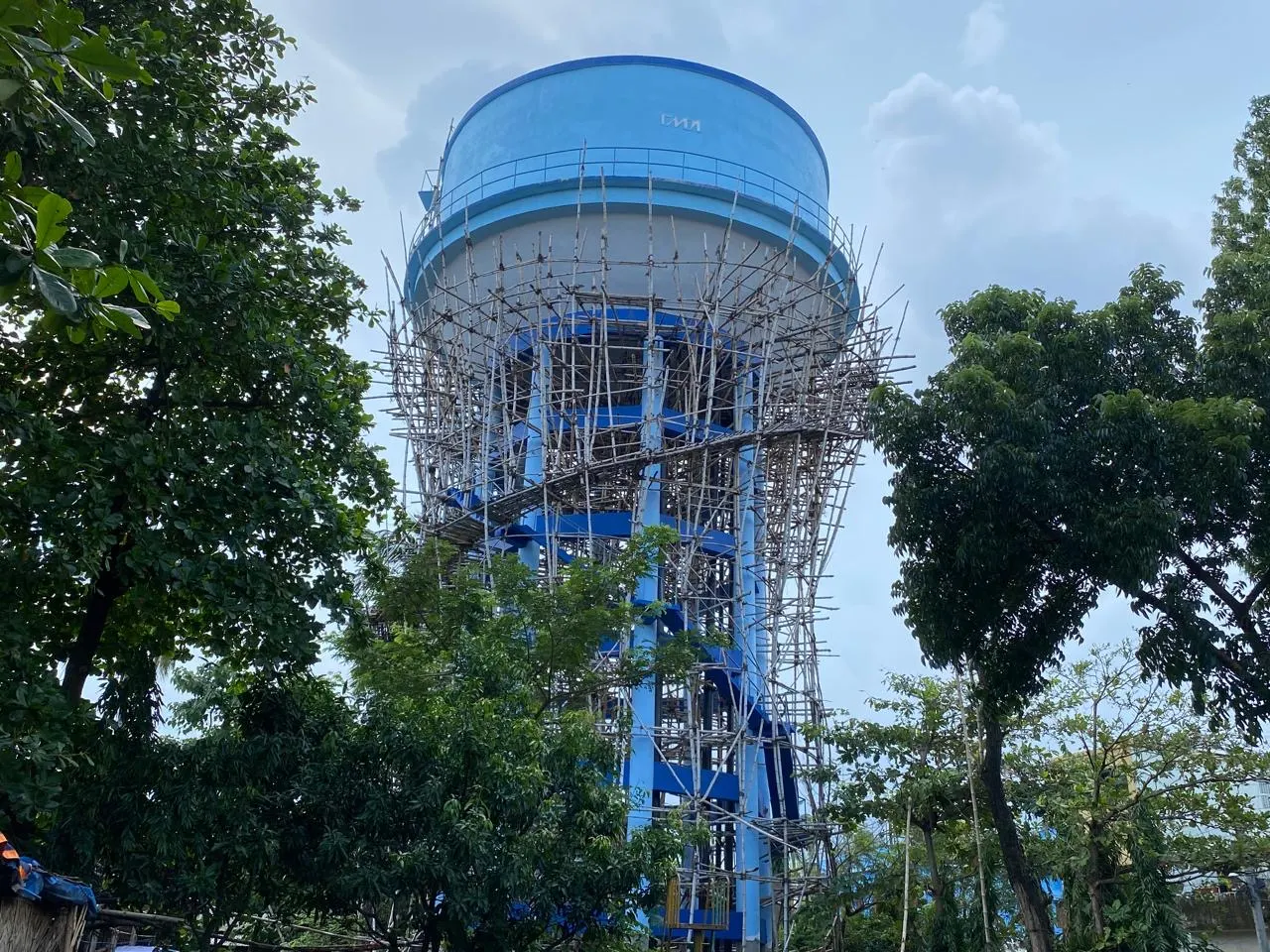 Water tower construction with bamboo scaffolding, New Town